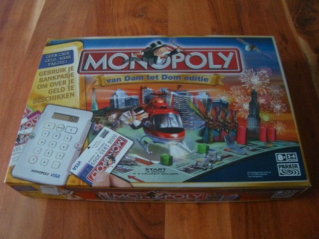 Monopoly Van Dam tot Dom editie met pinautomaat, Ophalen of Verzenden, Zo goed als nieuw, Parker