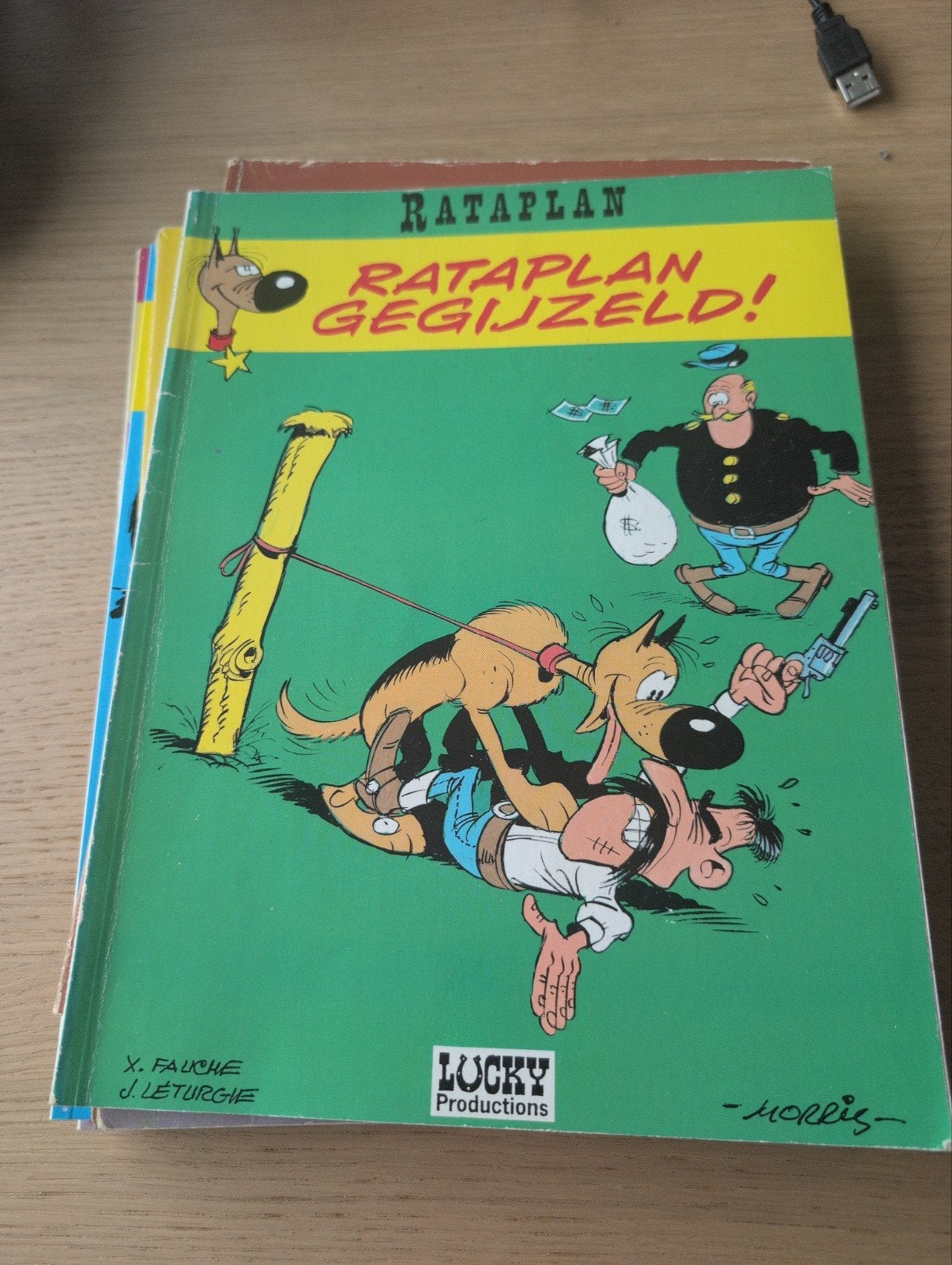 Rataplan Gegijzeld! - Lucky Luke stripboek, Eén stripboek, Ophalen of Verzenden, Gelezen, X. Fauche, J. Leturgie, Morris