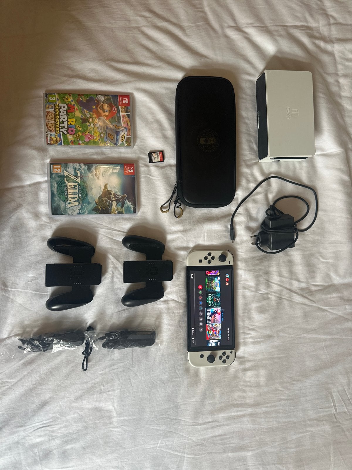 Nintendo Switch OLED met 3 games en accessoires