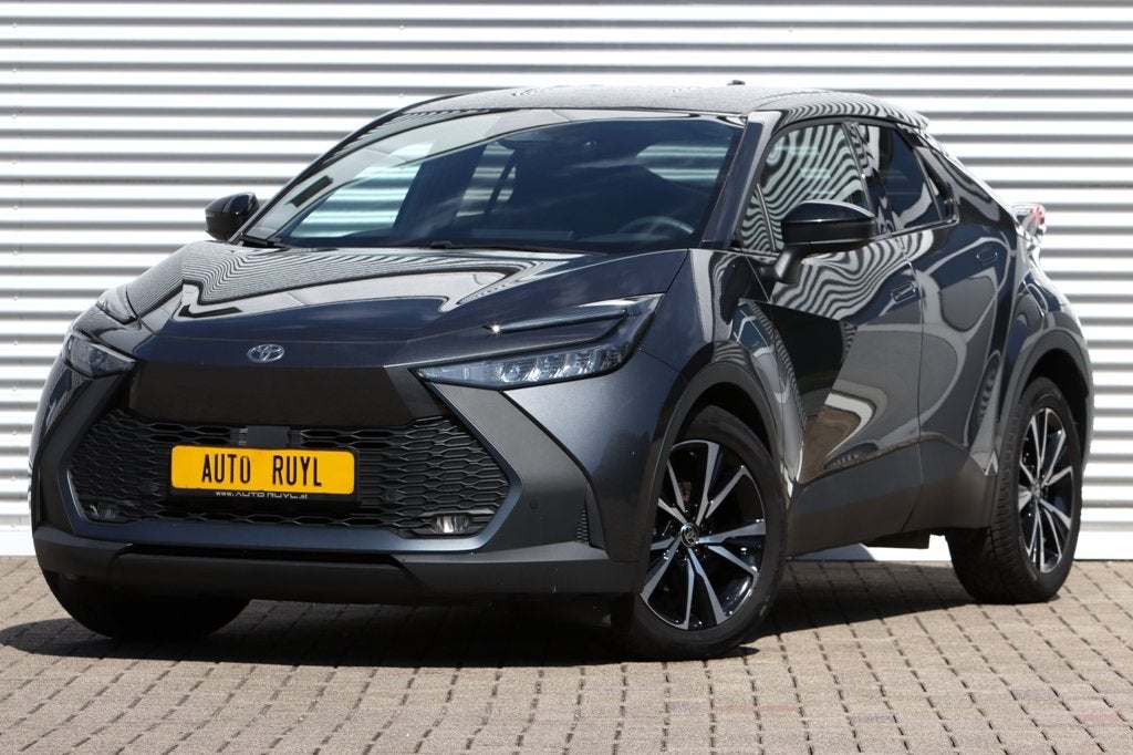 Toyota C-HR 1.8 Hybrid 140 Dynamic (bj 2024, automaat), Auto's, Dealer onderhouden, Stof, Gebruikt, Zwart