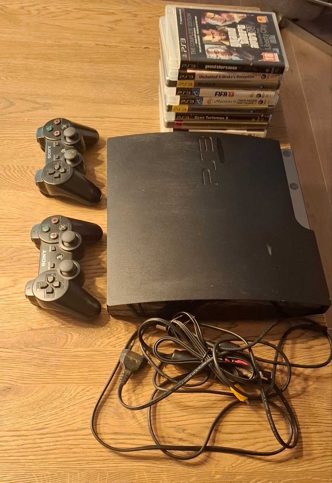Sony PlayStation 3 (PS3) met 2 controllers en 10 games, Spelcomputers en Games, Gebruikt, Vanaf 18 jaar, 2 spelers, Ophalen of Verzenden