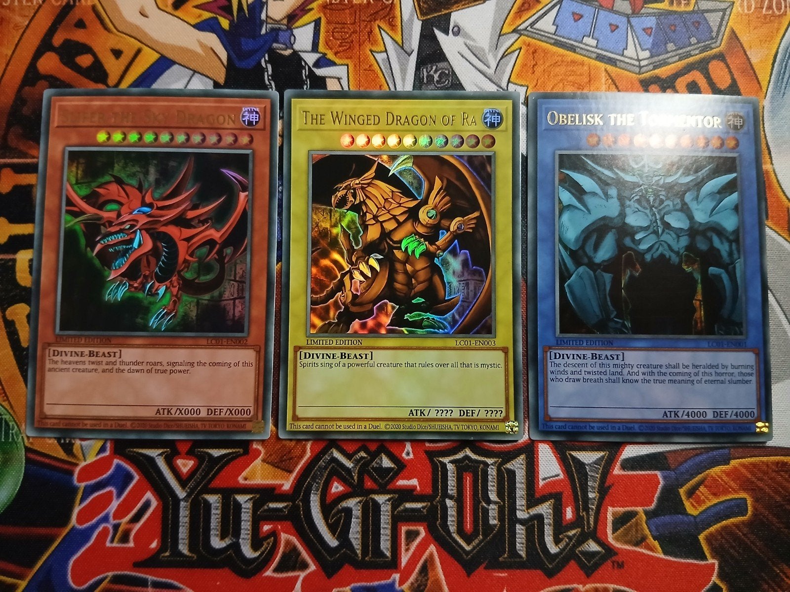 Egyptian God Set - Ultra Rare LC01 Legendary Collection YGO, Ophalen of Verzenden, Zo goed als nieuw, Meerdere kaarten, Foil