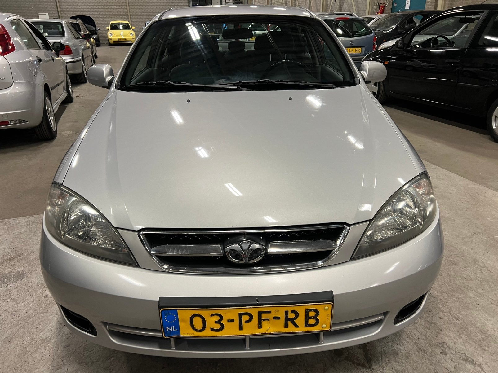Daewoo Lacetti 1.6 HB 2004 Grijs km 224789, Auto's, Voorwielaandrijving, Lacetti, 4 cilinders, 610 kg