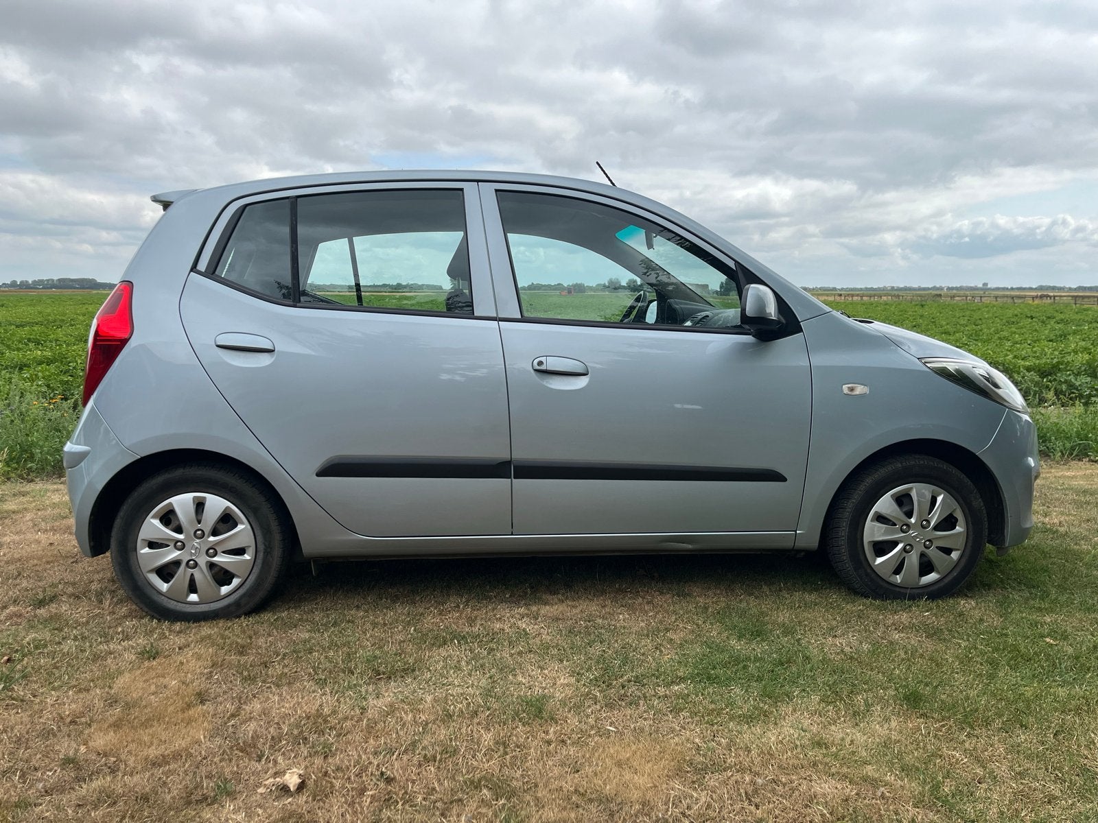 Hyundai i10 1.1 I 5DR met lage km stand en trekhaak, Stof, 4 cilinders, 400 kg, Origineel Nederlands