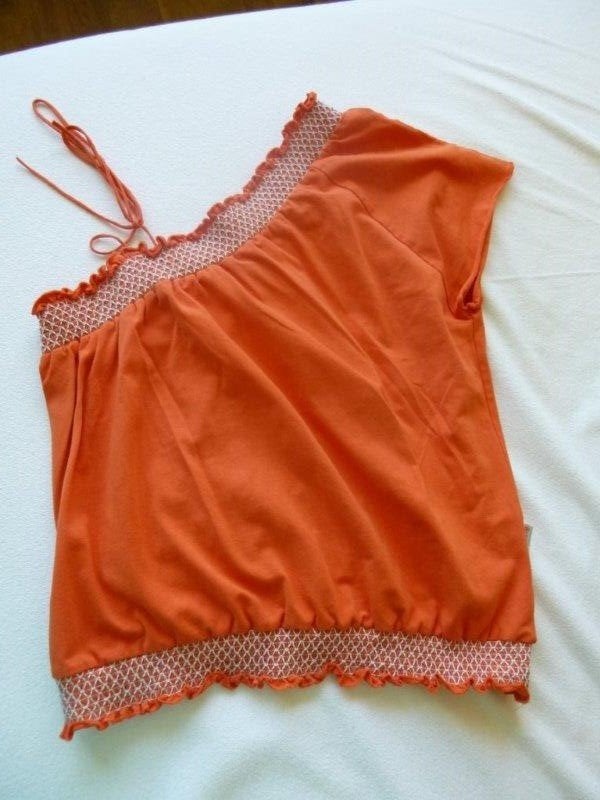 Carbone oranje shirt, met één schouder, maat 164., Ophalen of Verzenden, Zo goed als nieuw, Meisje, Shirt of Longsleeve