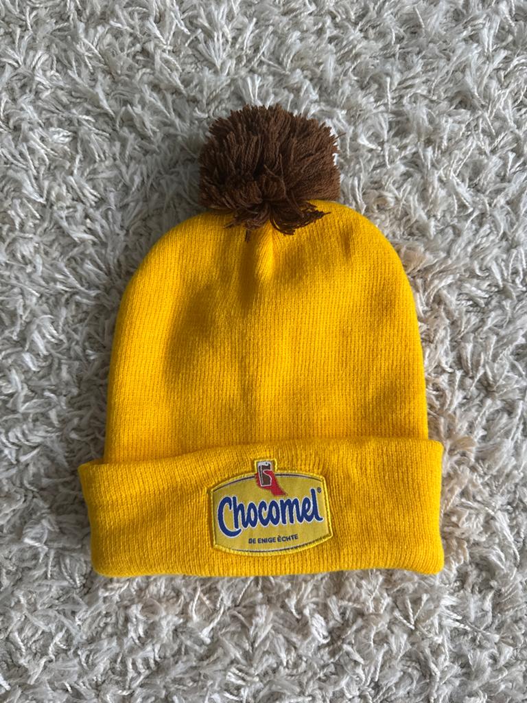 Chocomel Muts met Pompon - Geel, Ophalen of Verzenden, Zo goed als nieuw