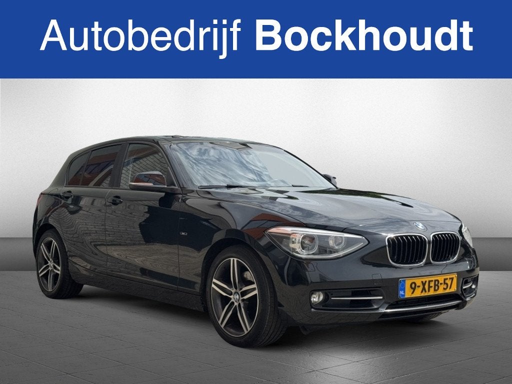 BMW 1-serie 118i Executive | Navi | Stoelverwarming, Auto's, Achterwielaandrijving, Gebruikt, 4 cilinders, Zwart
