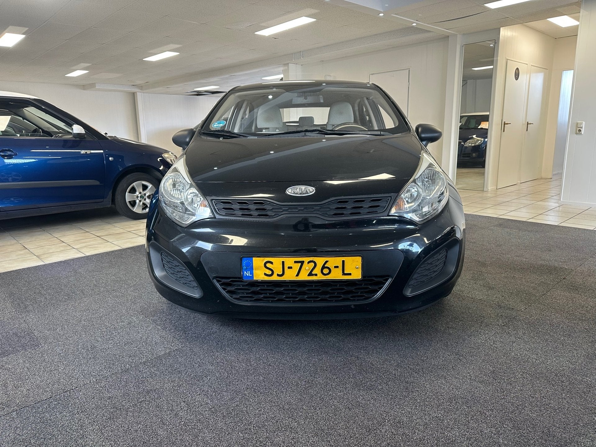Kia Rio 1.2 CVVT Comfort Pack, Auto's, Voorwielaandrijving, Euro 5, 4 cilinders, Zwart