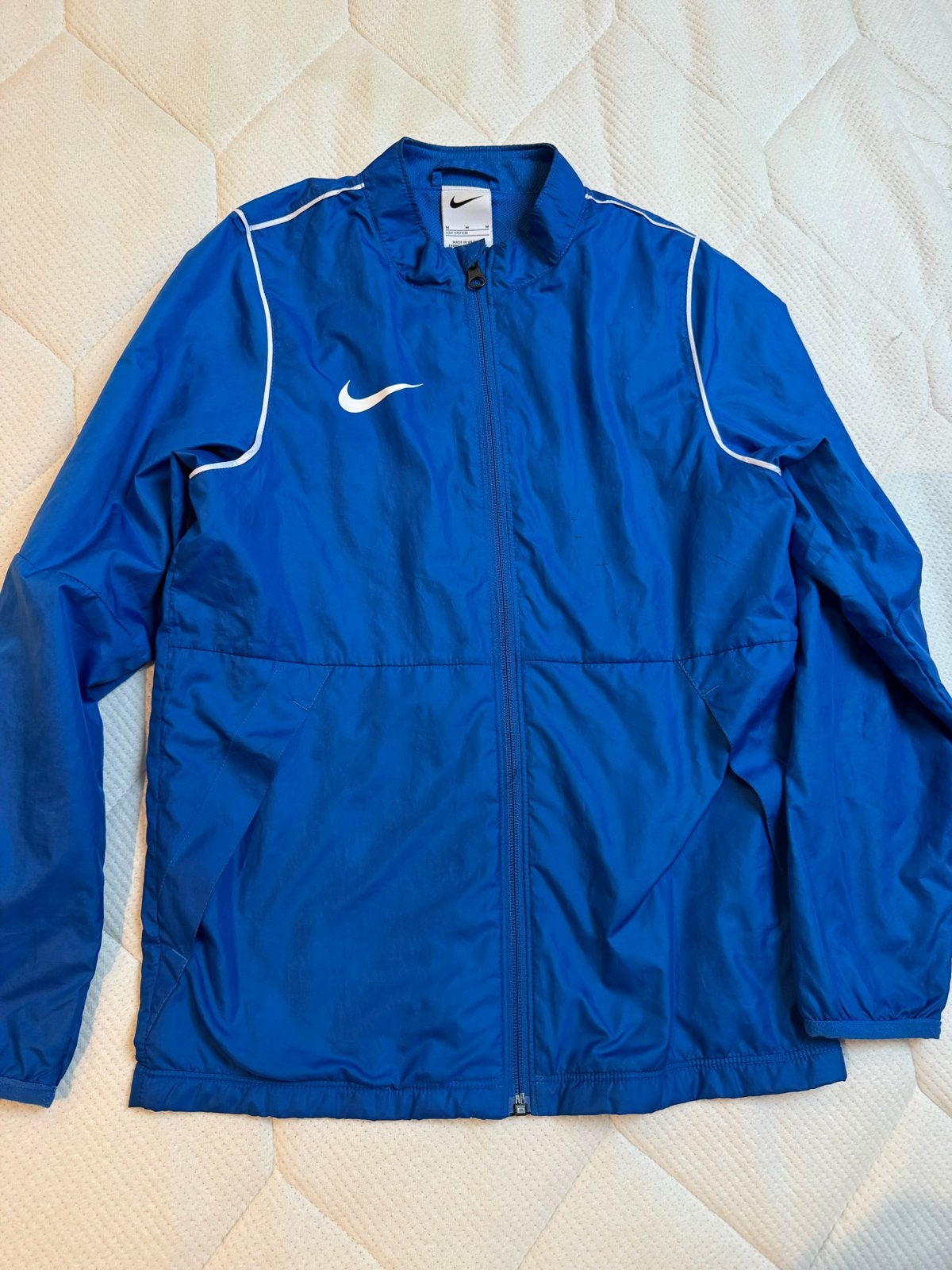 Nike park blauwe wind/ regen jas  maat 140, Ophalen of Verzenden, Zo goed als nieuw, Jongen of Meisje, Jas