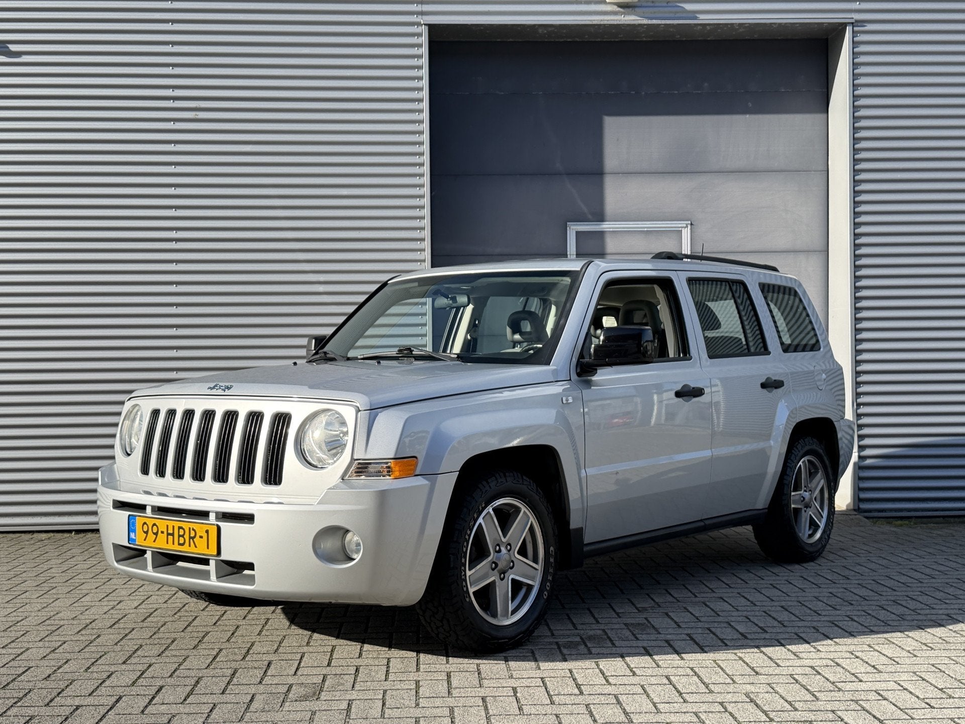 Jeep Patriot 2.4 Sport Adventure I 4x4 I Airco I Nl Auto, Auto's, Gebruikt, Zwart, 4 cilinders, Patriot