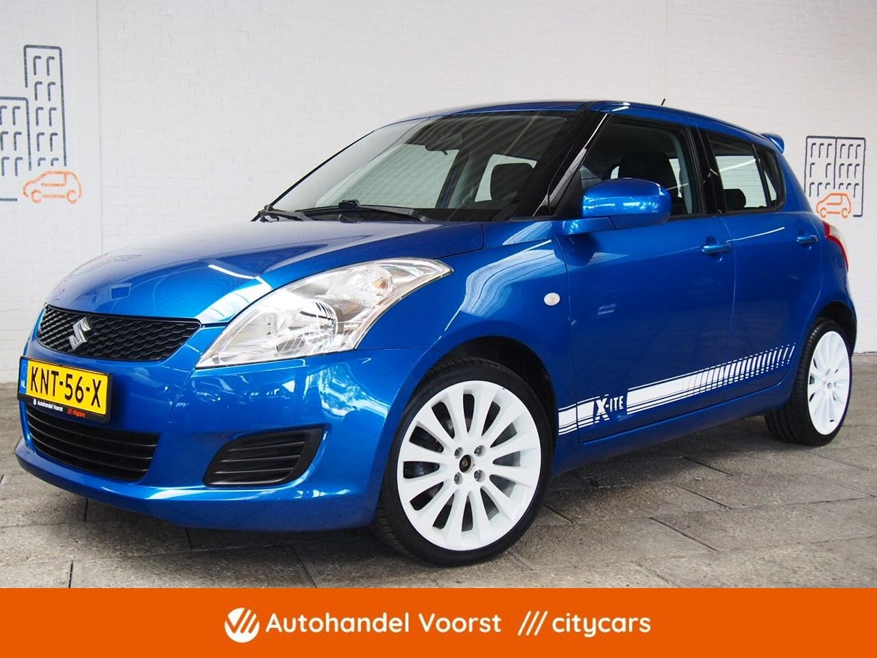 Suzuki Swift 1.2 Comfort X-ite Airco (APK:Nieuw) Incl.Garant, Voorwielaandrijving, Euro 5, Stof, Gebruikt