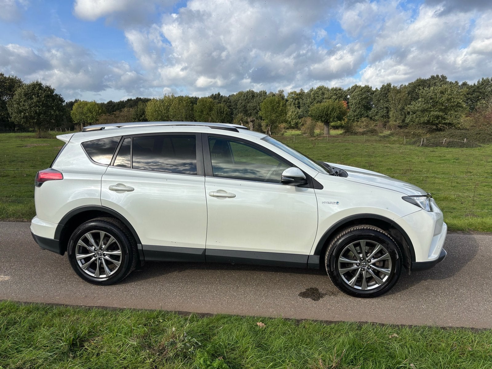 Toyota RAV4 2.5 HYBRID AWD 2016 wit, Auto's, Automaat, 1650 kg, Wit, Vierwielaandrijving