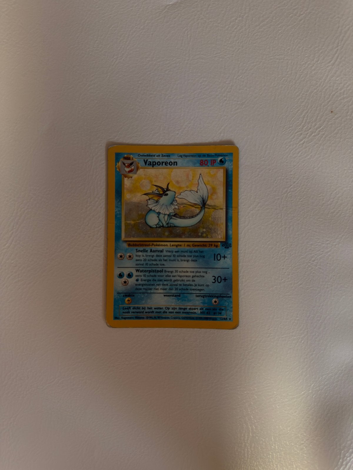 Vaporeon 12/64 dutch, Hobby en Vrije tijd, Ophalen of Verzenden, Gebruikt, Losse kaart
