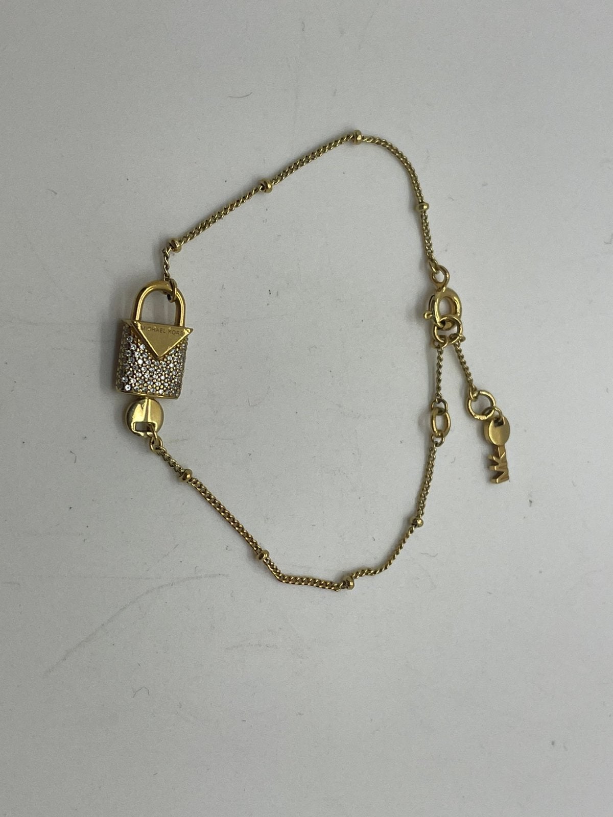 F419 Prachtige zilveren Michael Kors armband goudkleur, Ophalen of Verzenden, X, Goud, X