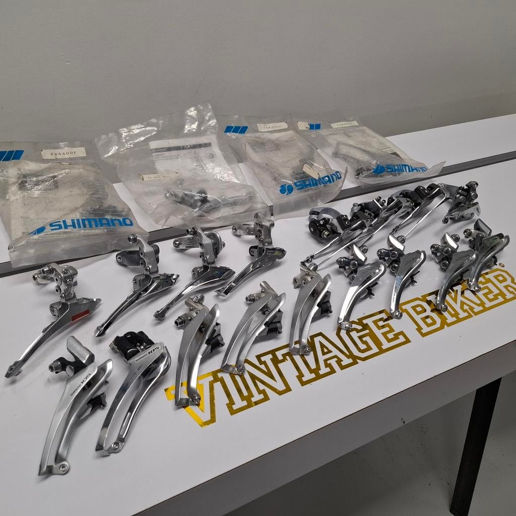 Partij (ca. 20) Retro Shimano Voorderailleurs deels NOS, Ophalen of Verzenden, Zo goed als nieuw, Derailleur of Ketting, Shimano