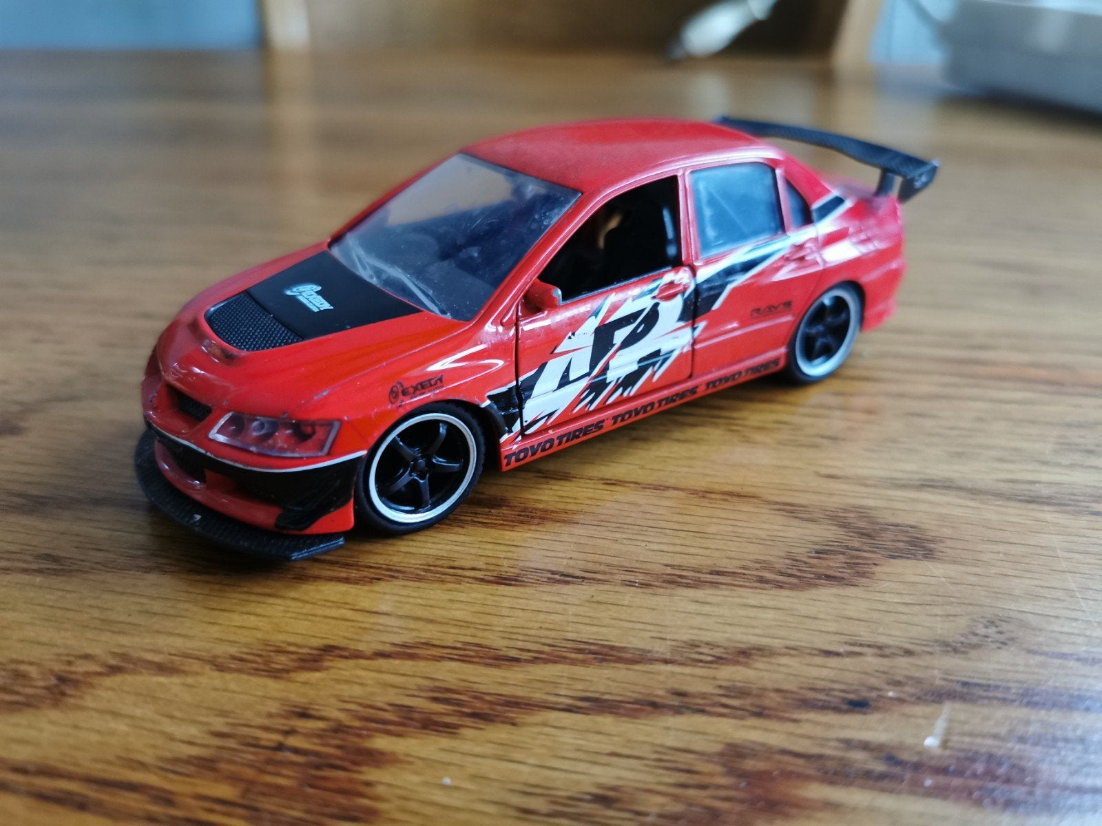 Mitsubishi Lancer Evolution X modelauto rood, Ophalen of Verzenden, Zo goed als nieuw, Auto, Overige merken