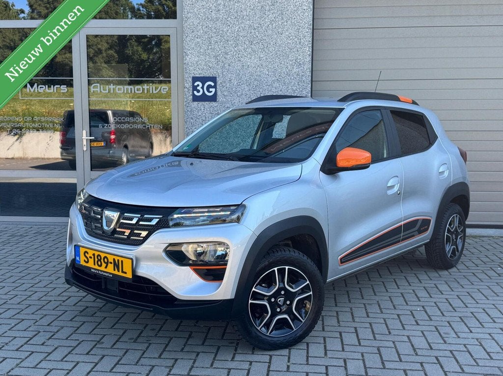 Dacia Spring Comfort Plus (Orange Pack) 27 kWh DC Lader/Navi, Auto's, Dacia, Gebruikt, Zwart, 38 min, 230 km