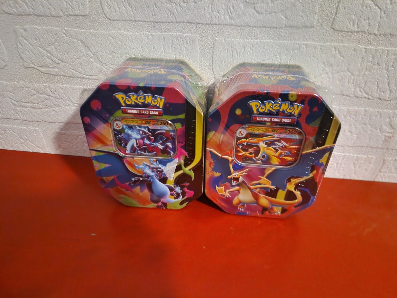 Pokémon Mega Charizard X & Y EX tins, Ophalen of Verzenden, Nieuw, Boosterbox