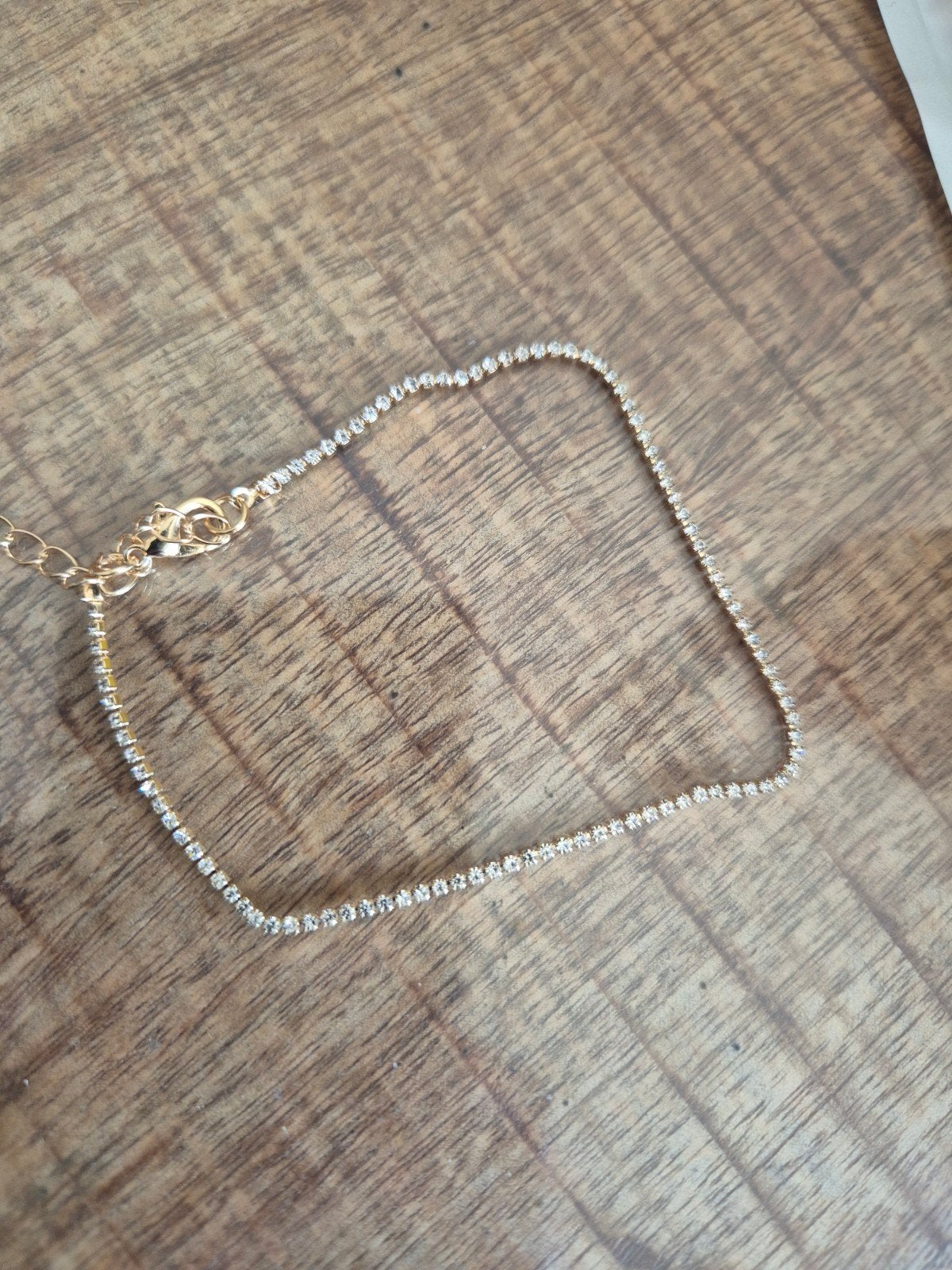 Goudkleurige tennisarmband met strass-steentjes, Sieraden, Tassen en Uiterlijk, Overige materialen, Nieuw, Ophalen of Verzenden
