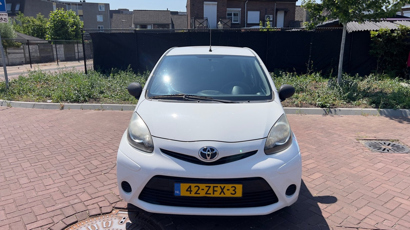 Toyota Aygo 1.0 12V Vvt-i 5DRS 2012 Wit, Auto's, Toyota, Voorwielaandrijving, Stof, Zwart, Elektrische ramen