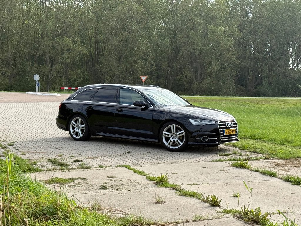 Audi A6 Avant 1.8 TFSI 190pk S line Pano ACC Trekhaak 2016, Auto's, Verwarmde buitenspiegels, 1610 kg, Zwart, Leder en Stof