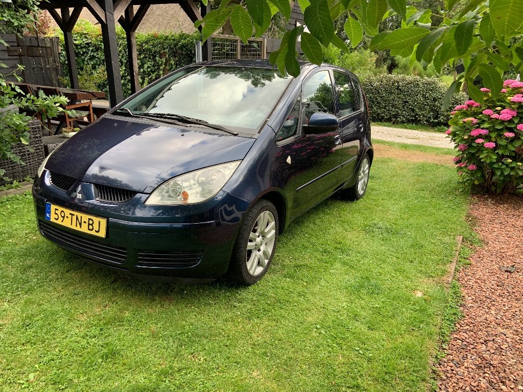 Mitsubishi Colt 1.3 CZ5 2006 Blauw, Auto's, Stof, 31 €/maand, Blauw, Colt