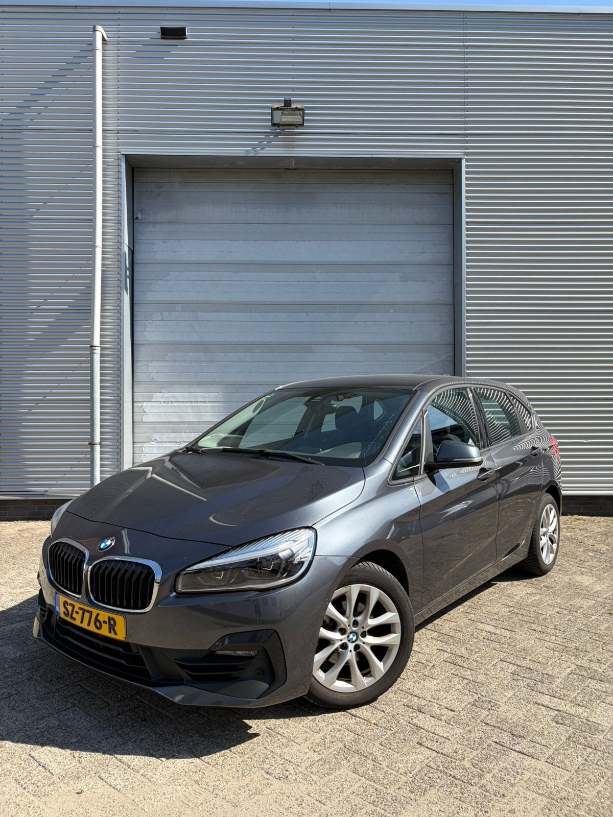BMW 218i 140pk Automaat 2018 | volledige onderhoudshistorie, Auto's, Stof, Zwart, 75 €/maand, Particulier