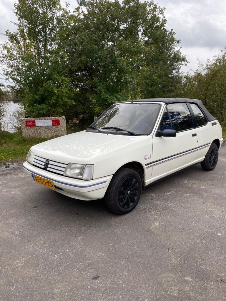 Peugeot 205 1.1 CJ Cabriolet U9 1991 Wit, Auto's, Voorwielaandrijving, Stof, 4 cilinders, Cabriolet