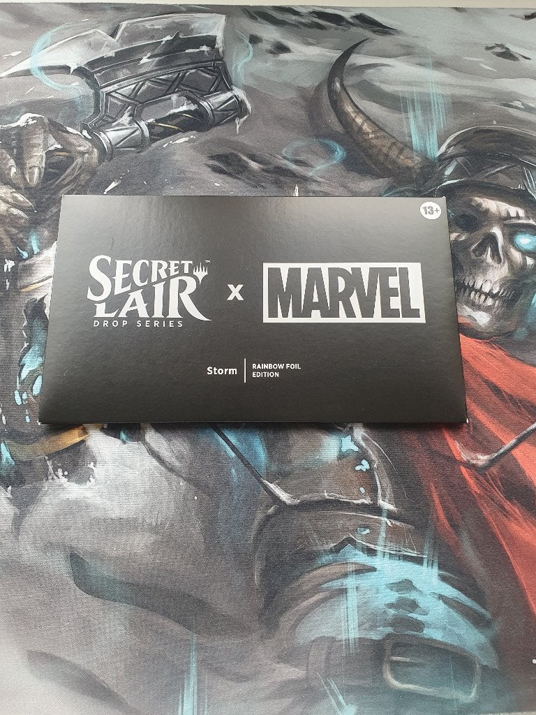 Magic the Gathering Secret Lair x Marvel Storm rainbow  foil, Ophalen of Verzenden, Nieuw, Meerdere kaarten, Foil