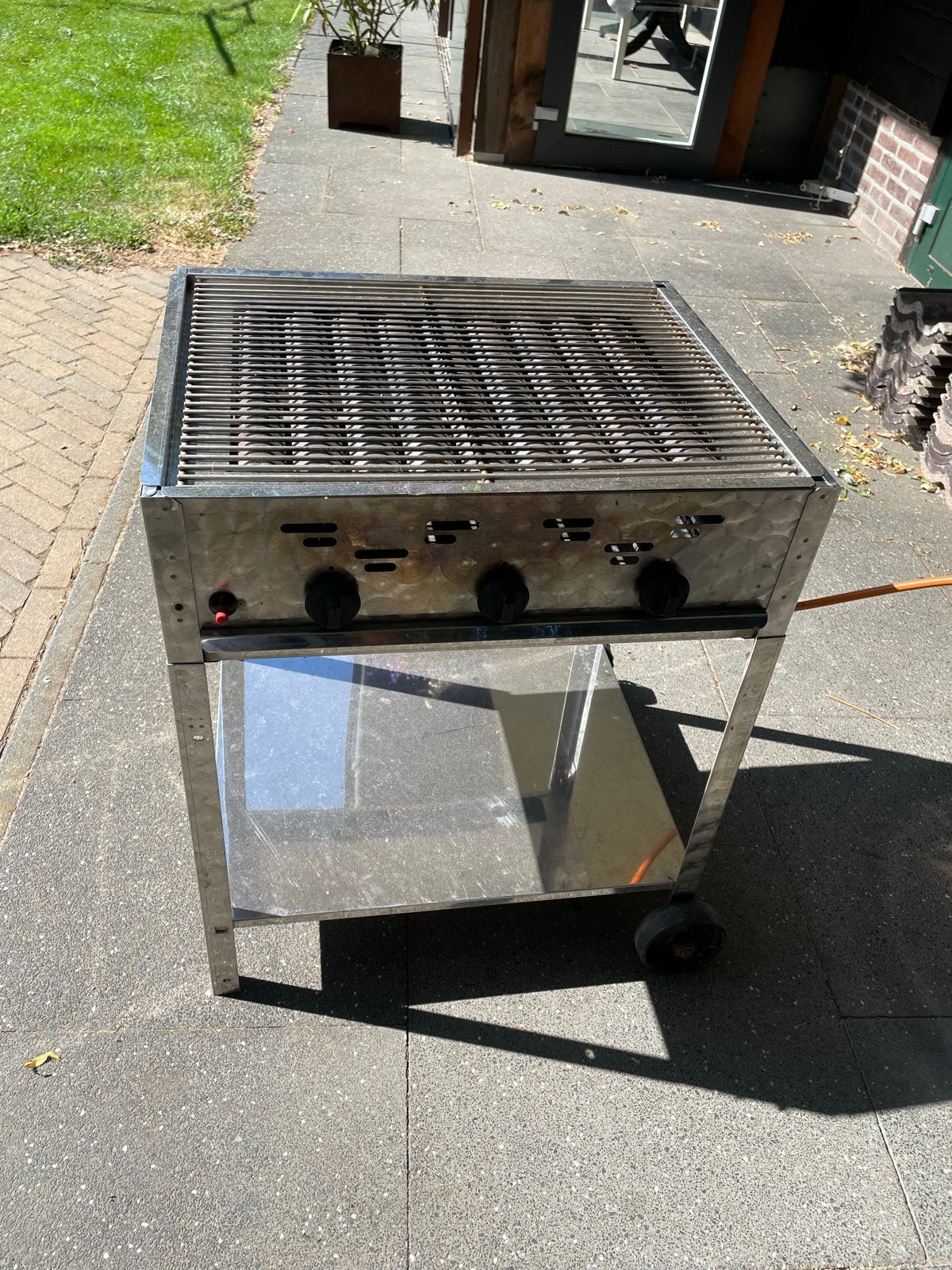 Slagersbarbecue op propaangas, 12 kW, RVS met wieltjes, Ophalen, Gebruikt