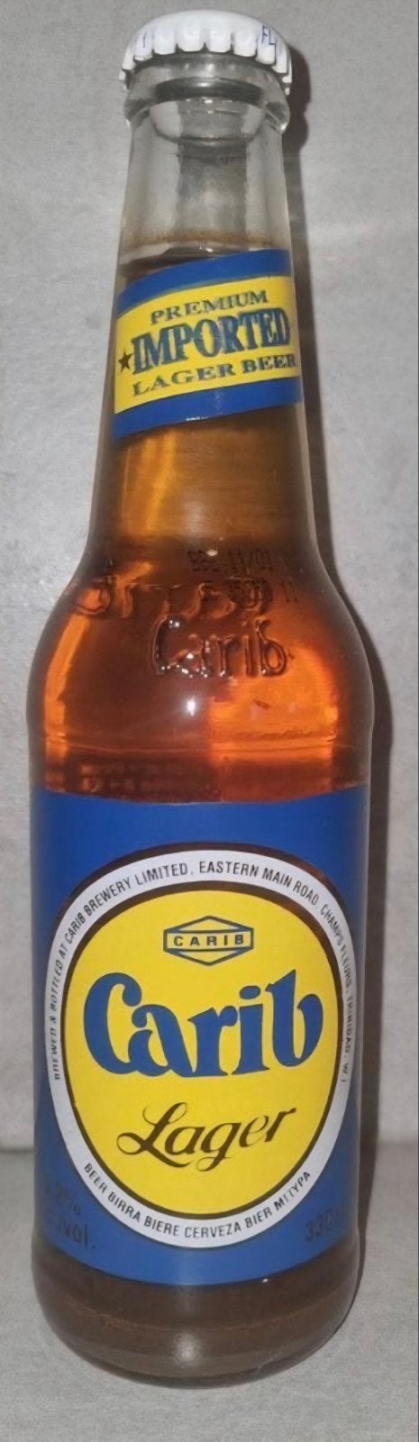 Carib - Champs Fleurs, Trinidad, W.I.- Imported Lager -  '01, Ophalen of Verzenden, Zo goed als nieuw, Glas of Glazen, Overige merken