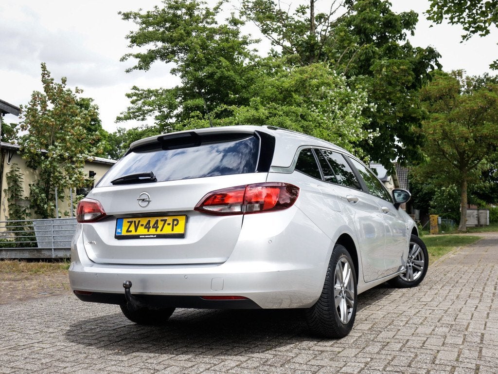 Opel Astra Sports Tourer 1.4 Turbo 120 Jaar Edition Keurig-O, Auto's, 12 maanden, Stof, Gebruikt, Origineel Nederlands