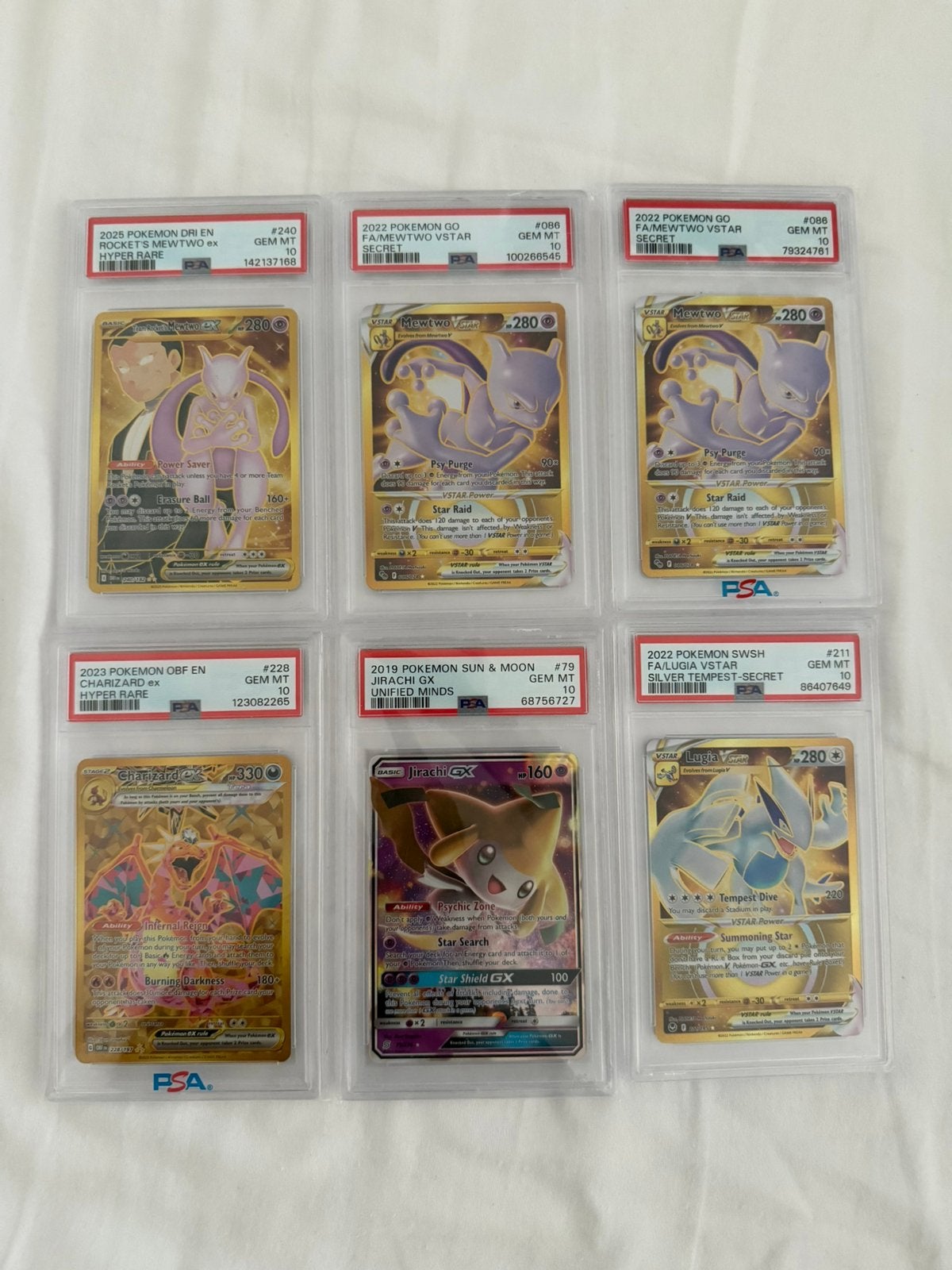 PSA 10 | Mewtwo | Lugia | Jirachi | Charizard, Ophalen of Verzenden, Zo goed als nieuw, Meerdere kaarten, Foil