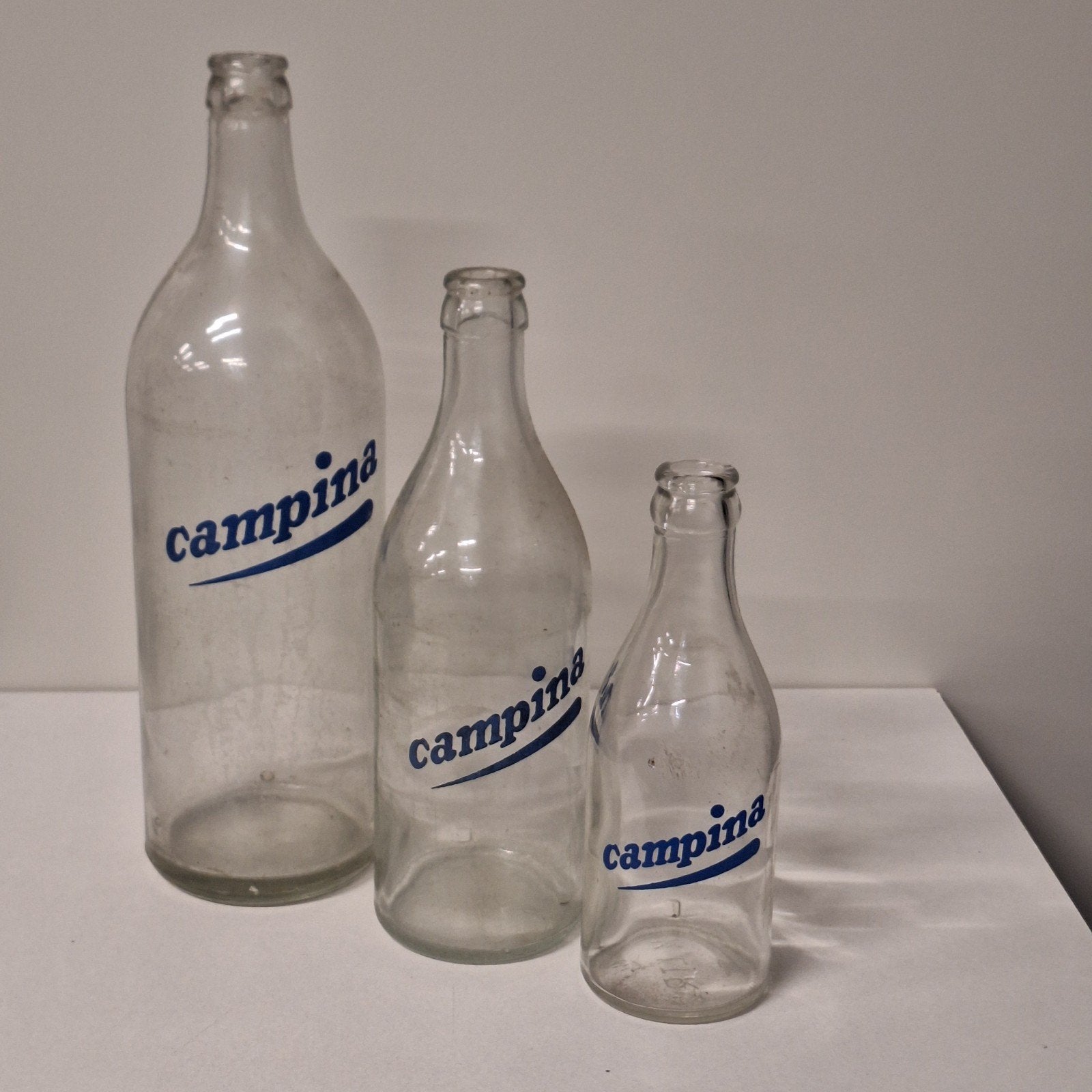 Set van 3 Campina melkflessen: 1/4, 1/2 en 1 liter, Verzenden, Gebruikt
