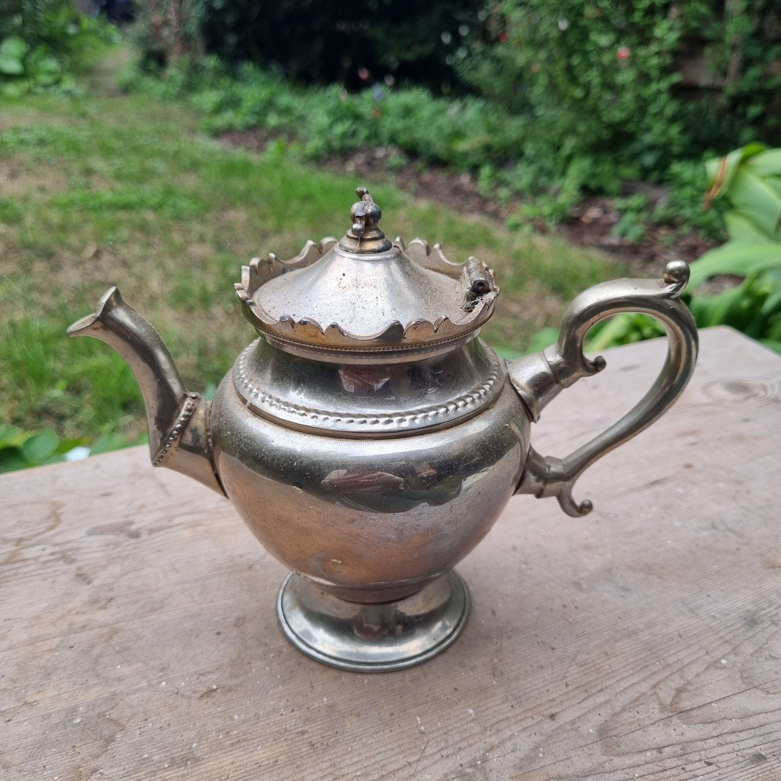 Antieke verzilverde theepot, Ophalen