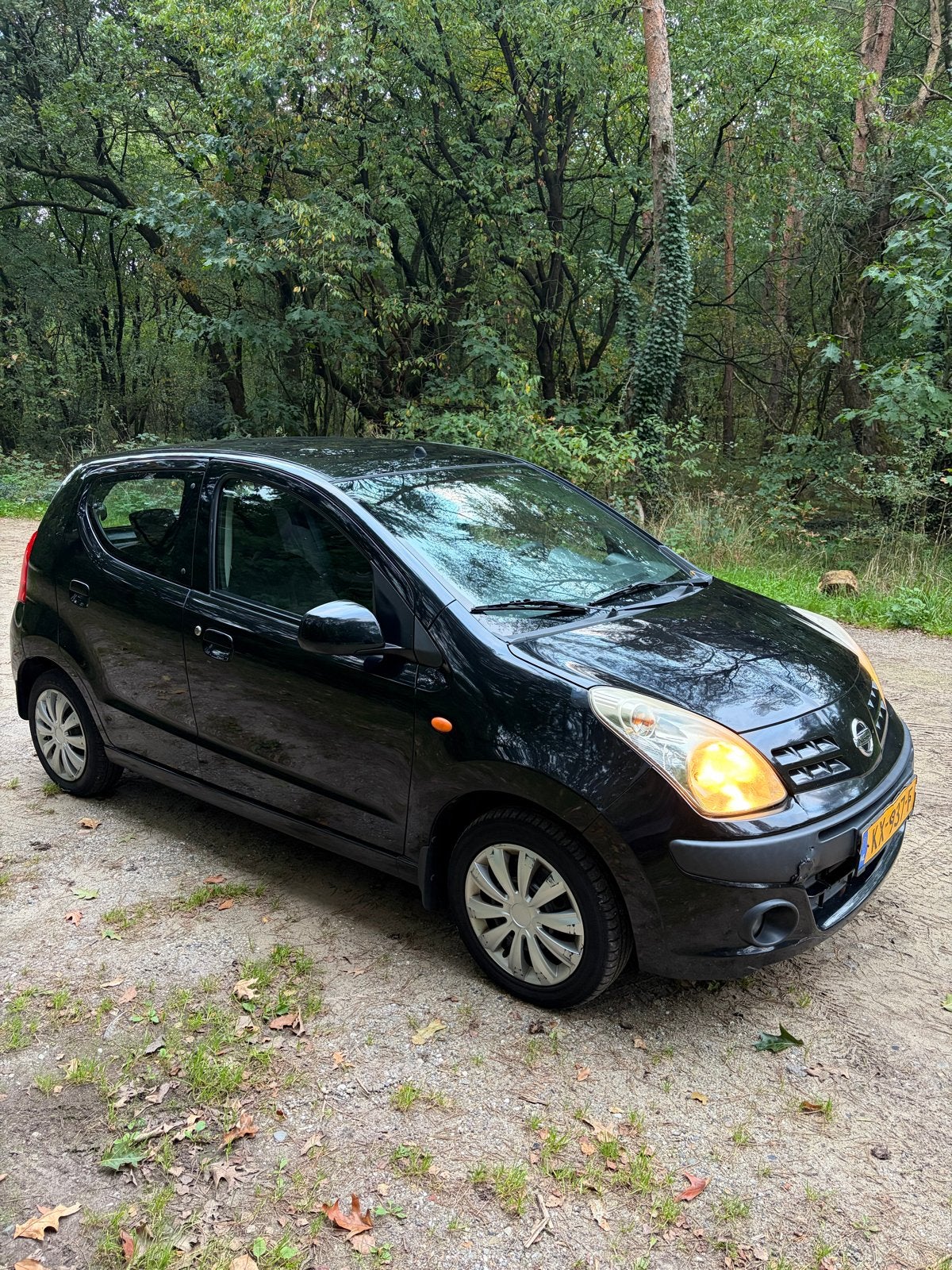Nissan Pixo 1.0 50KW 5D 2009 Zwart, Auto's, Voorwielaandrijving, Euro 5, Stof, 4 stoelen