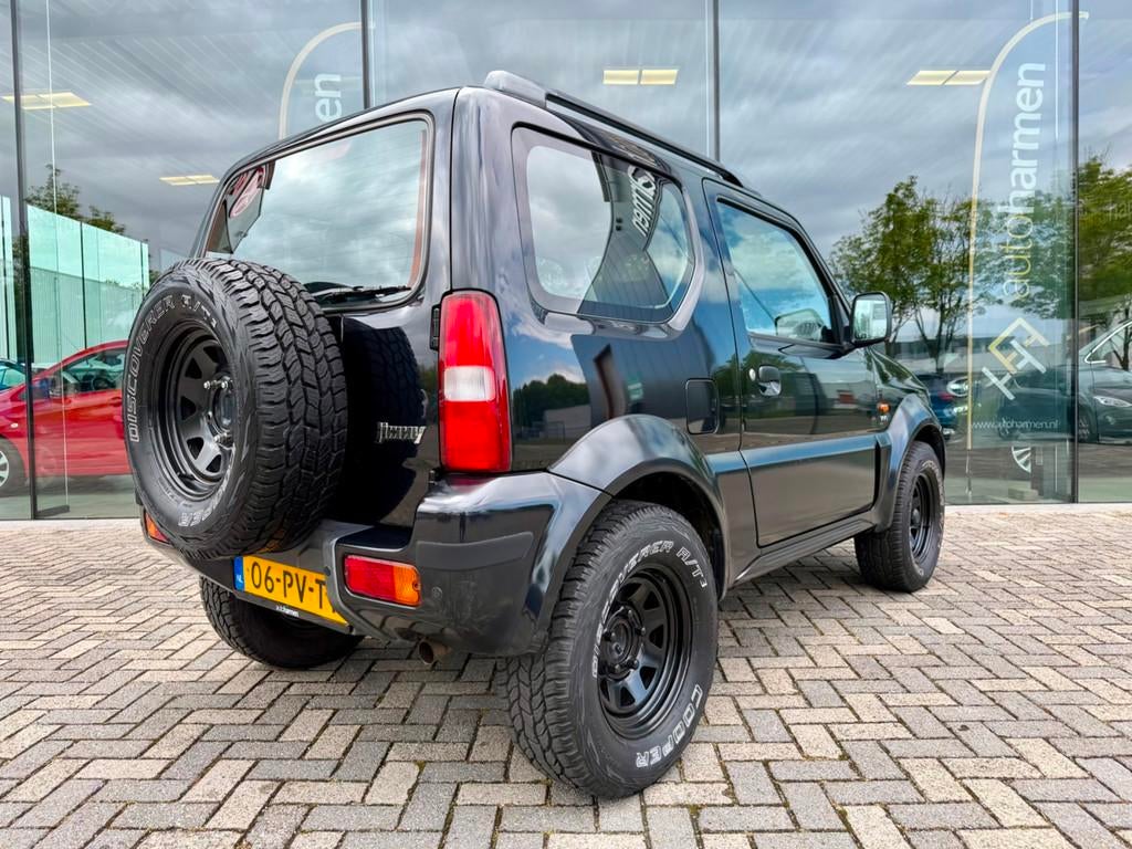 Suzuki Jimny 1.3 JLX 4x4, Airco, NAP, Auto's, Suzuki, Zwart, 4 stoelen, Zwart, Bedrijf