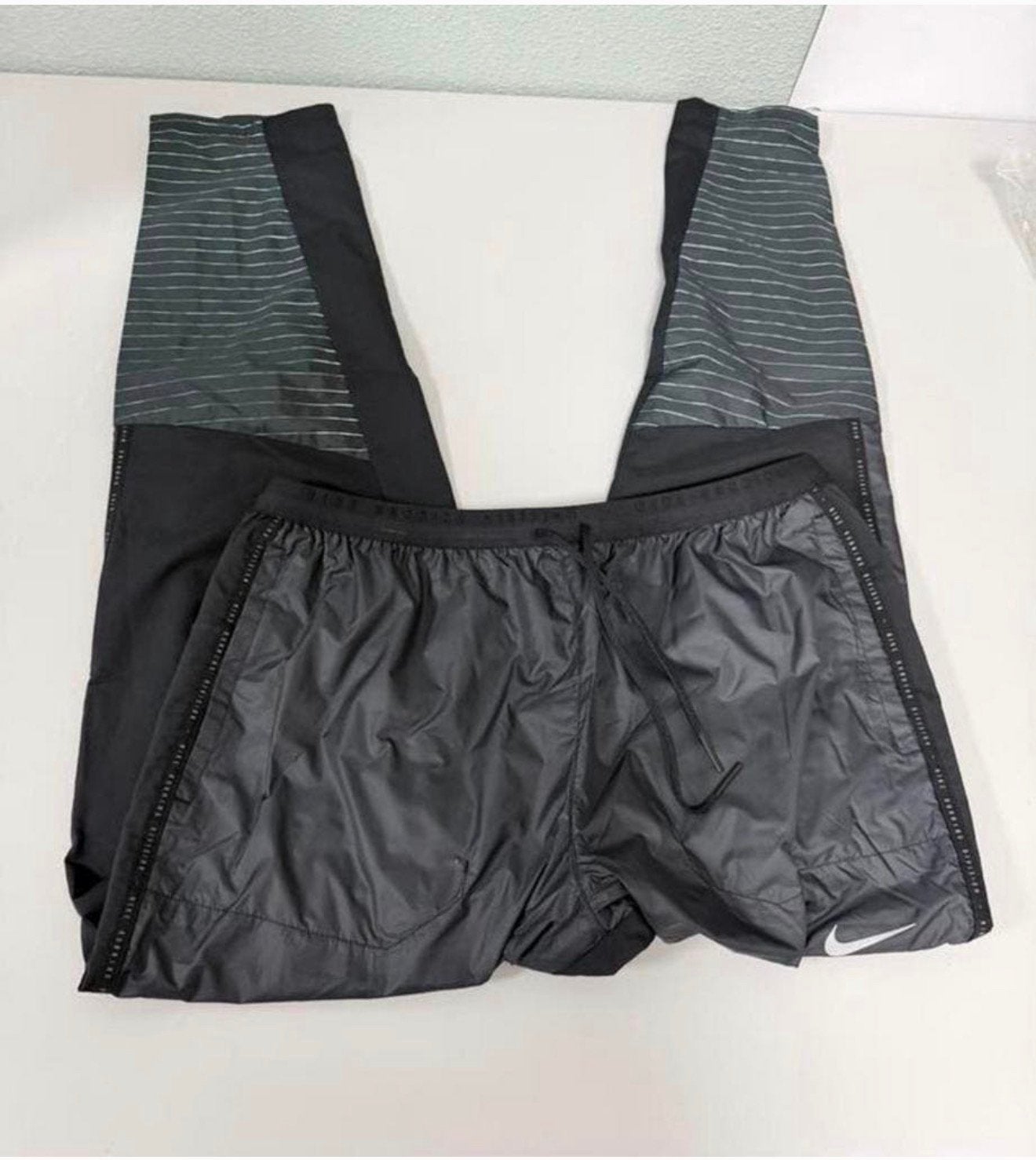 Nike Storm-FIT Running Division broek maat L waterproof zgan, Caravans en Kamperen, Regenbroek, Ophalen of Verzenden, Zo goed als nieuw