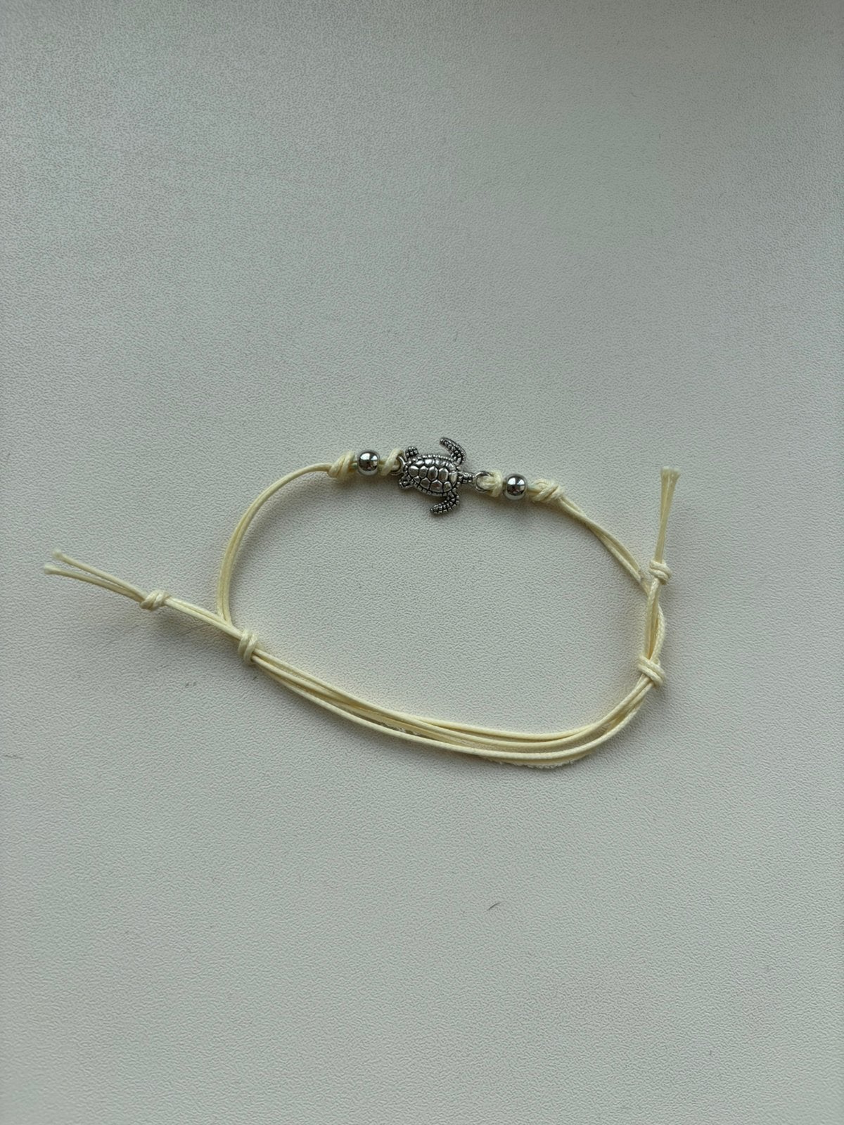 Geel schildpad armbandje, Sieraden, Tassen en Uiterlijk, Ophalen of Verzenden, Zo goed als nieuw, Geel