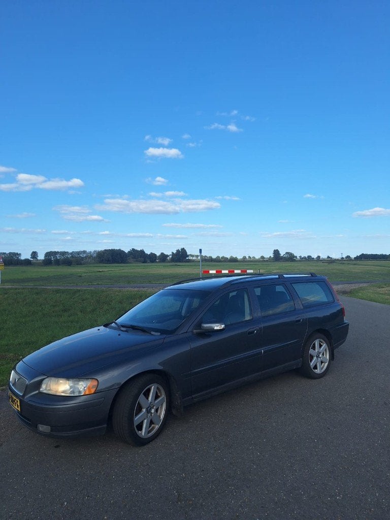 Volvo V70 2.4 140PK AUT 2007 Grijs, Auto's, 1800 kg, Zwart, Leder en Stof, 1498 kg