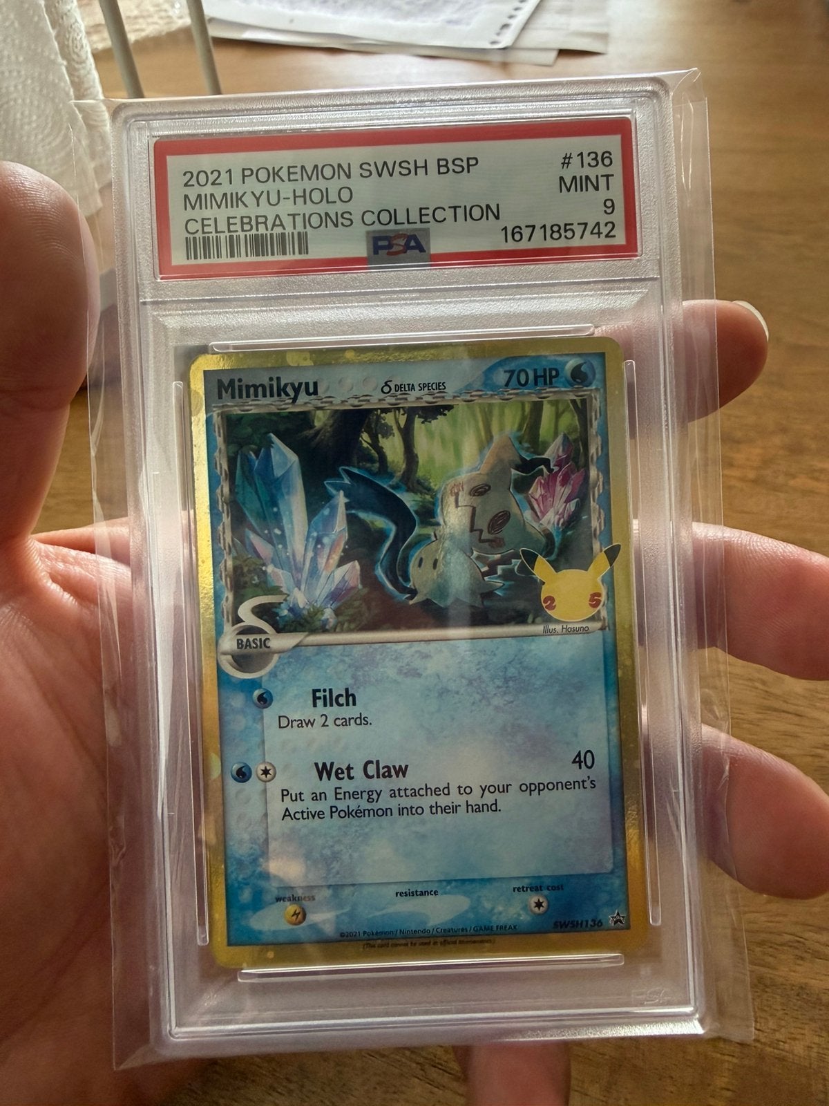 Mimikyu holo Celebrations PSA9, Hobby en Vrije tijd, Ophalen of Verzenden, Zo goed als nieuw