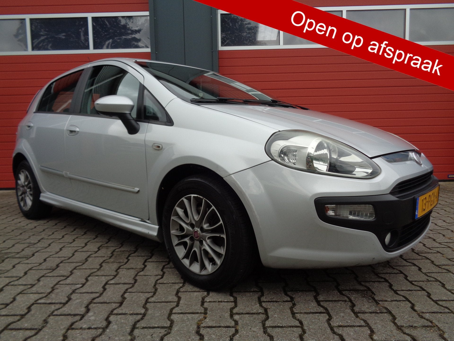 Fiat Punto Evo 1.3 M-Jet Dynamic Clima Cruise LMV Navi 5DRS, Auto's, Voorwielaandrijving, Euro 5, Gebruikt, Navigatiesysteem