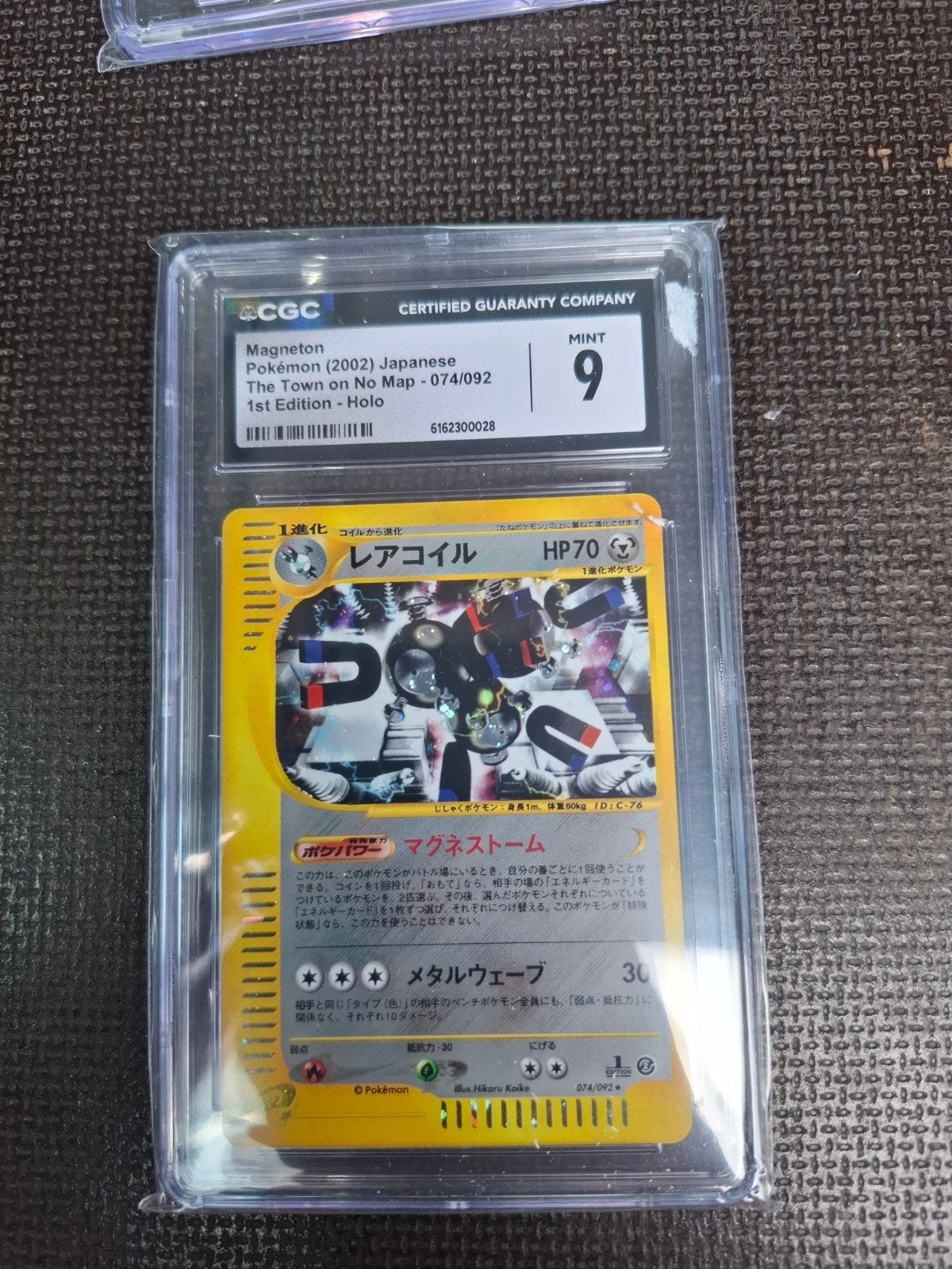 Pokemon Magneton 1st edition #074 CGC 9, Ophalen of Verzenden, Zo goed als nieuw