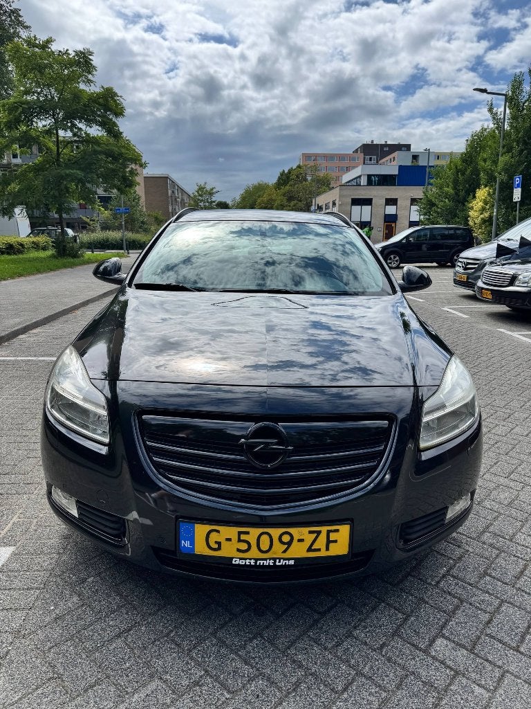 Opel Insignia 1.6 85KW Sports Tourer 2011 Zwart, Auto's, Euro 5, 4 cilinders, Overige bekleding, Handgeschakeld