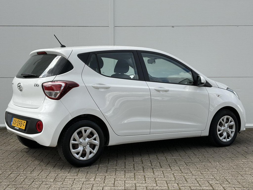 Hyundai i10 1.0i Comfort / Airco / Cruise control /, Auto's, Hyundai, Stof, Gebruikt, 4 stoelen, Wit