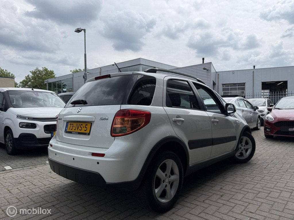 Suzuki SX4 1.6 Exclusive Parelmoer wit 1 jaar APK, 15 km/l, Gebruikt, 4 cilinders, Automatische klimaatregeling