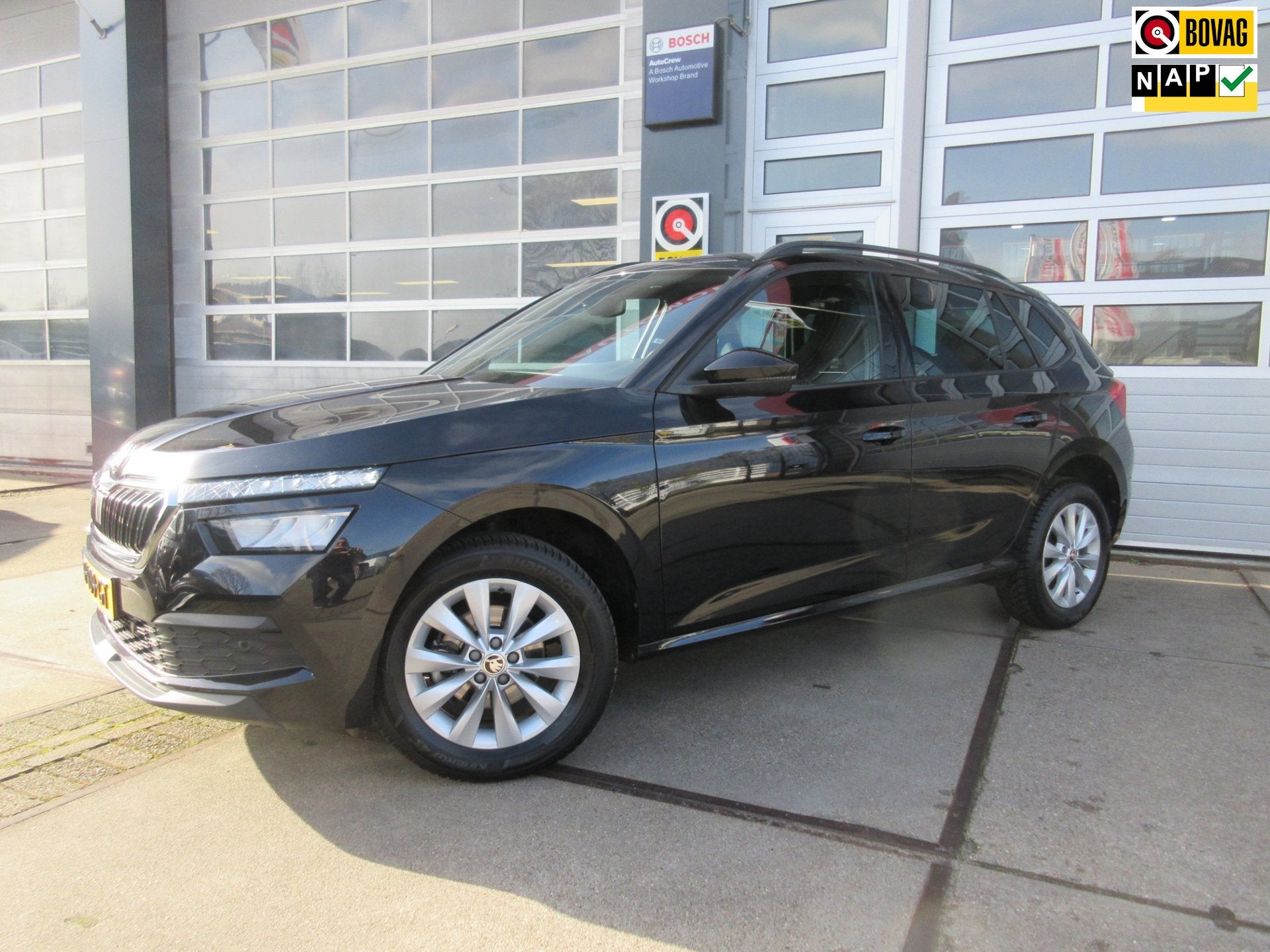 Skoda Kamiq 1.0 TSI Sport Business / Carplay / PDC / Navi, Stof, Gebruikt, Zwart, Origineel Nederlands