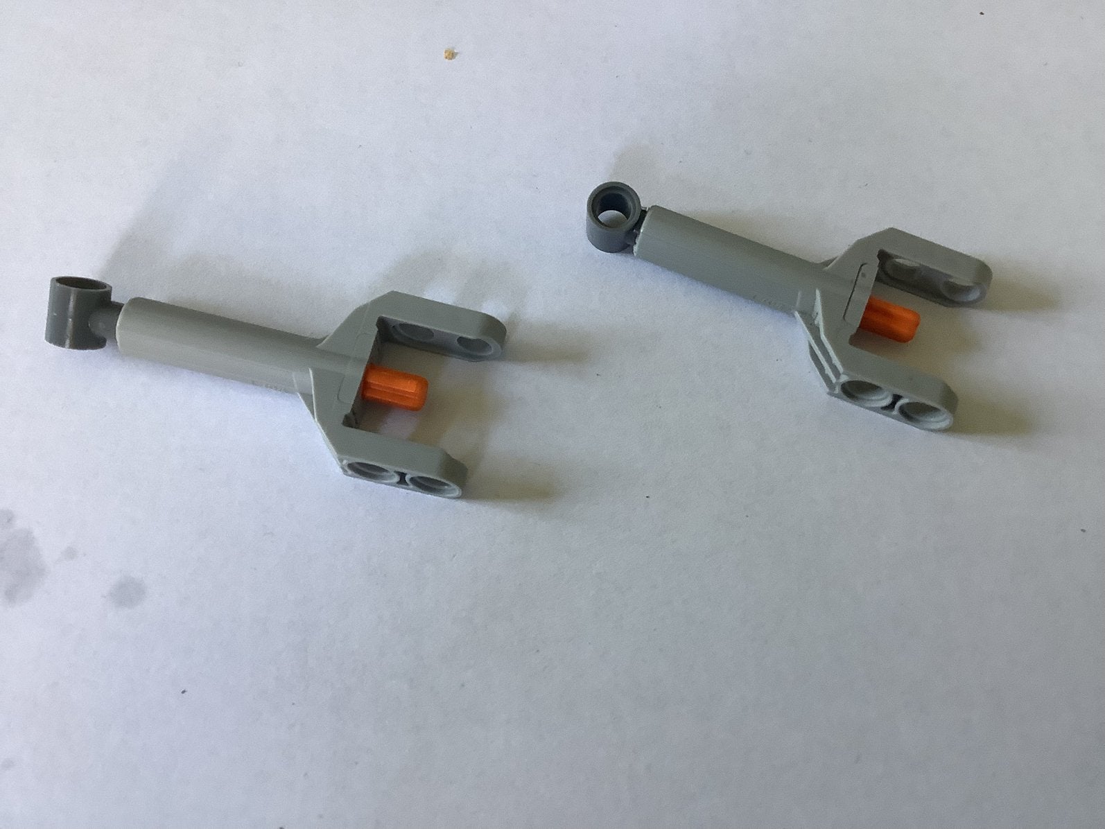Lego technic lineaire actuator mini grijze kop en oranje as, Ophalen of Verzenden, Gebruikt, Losse stenen, Lego