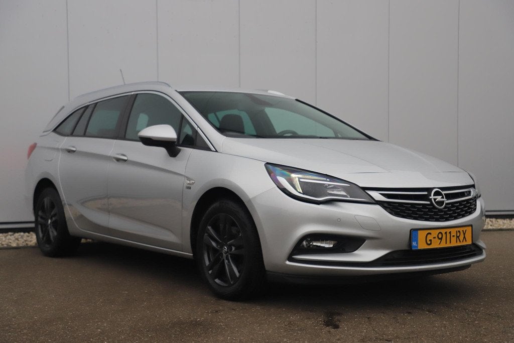 Opel Astra Sports Tourer 1.0 Turbo 120 Jaar Edition 16 inch, Stof, Gebruikt, Euro 6, 1178 kg