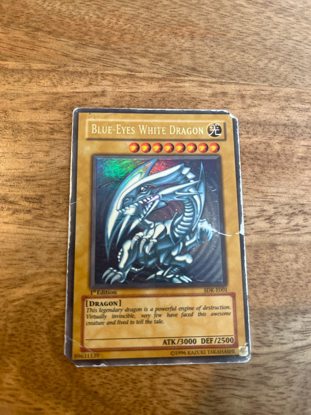 Yu-Gi-Oh! Blue-Eyes White Dragon 1st Edition SDK-E001, Ophalen of Verzenden, Gebruikt, Losse kaart, Foil